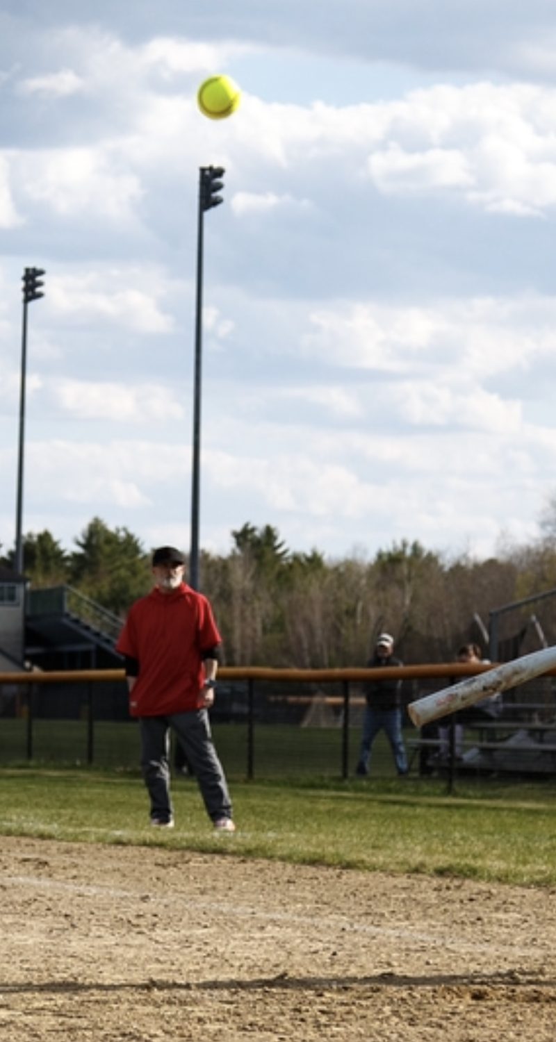 Andy on the softball field watching a pop fly